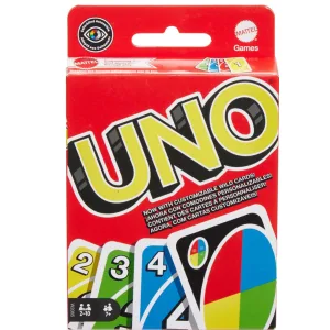 Scatola originale UNO Mattel appoggiata accanto alle carte distribuite